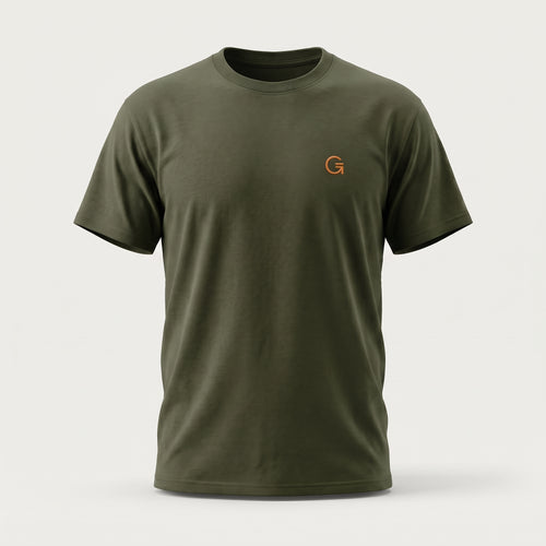 A ghost mannequin showing a military green short-sleeve t-shirt with a burnt orange “Clobber & Gear” logo embroidered on the left chest, set against a plain light grey background.