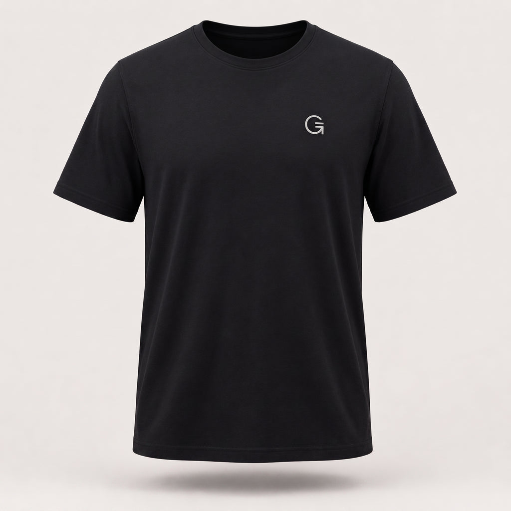 A ghost mannequin showing a black short-sleeve t-shirt with a white “Clobber & Gear” logo embroidered on the left chest, set against a plain light grey background.