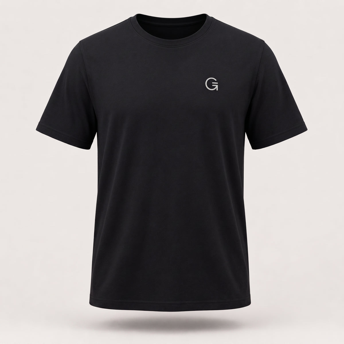 A ghost mannequin showing a black short-sleeve t-shirt with a white “Clobber & Gear” logo embroidered on the left chest, set against a plain light grey background.