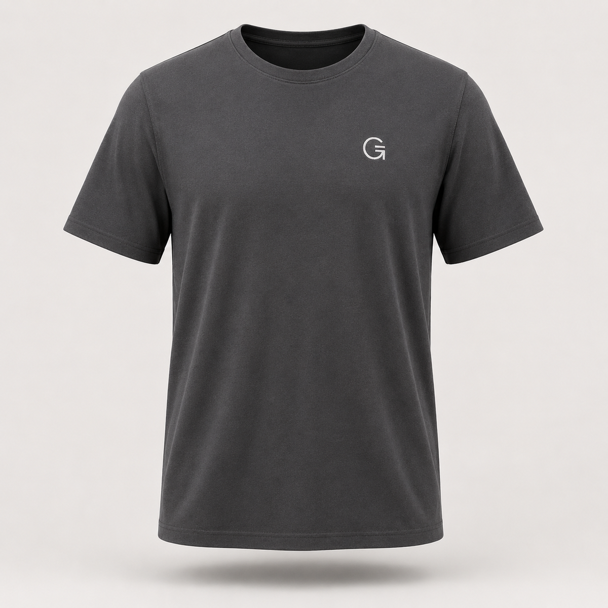 A ghost mannequin image of a charcoal crew-neck t-shirt with a white “Clobber & Gear” logo embroidered on the left chest, displayed on a neutral light grey background.